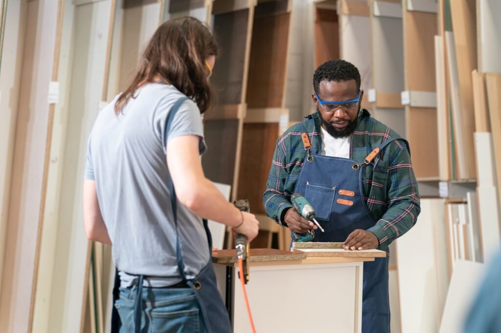 Carpenter working on the woodworking desk and furniture handmade with wood