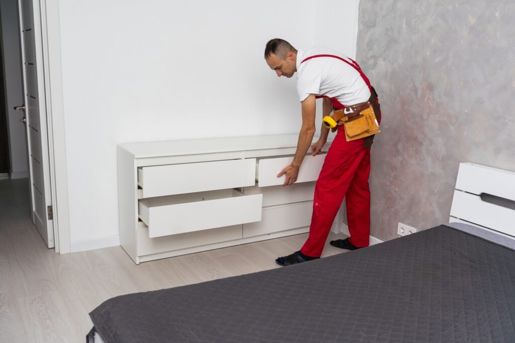 Professional furniture assembly and repair concept. Contractor repairman assembling furniture